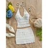 Nuevo top de verano sexy para mujer para vacaciones con tela texturizada y cuello halter, combinado con una falda de color liso