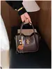 Bolsa de Mão Retrô de Nicho Feminina 2026 Primavera Novo Estilo Moda Tendência Bolsa Saco Casual para o Dia a Dia Ombro Único Transversal