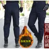 Pantalones de entrenamiento gruesos de color liso con felpa interior para invierno al por mayor, resistentes al desgaste, protección laboral, a prueba de frío, holgados, para tallas grandes, soldadura