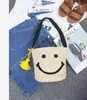 Bolsa de palha trançada de planta pp para mulheres coreanas, bolsa de barril tecida à mão com rosto sorridente