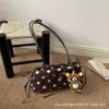Bolsa de Braço com Bolinhas e Laço Estilo Coreano Feminina 2026 Nova Bolsa Baguete Moda Retrô Bolsa de Mão com Alça de Ombro Outono