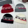 Gorro de punto con dobladillo de copo de nieve de cuatro colores para niños 2025 Nuevo Ambiente Retro Gorro de lana tejido jacquard para bebé niño
