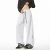 Nova coleção de outono: calça masculina com estampa de leopardo e cordão, pernas largas e soltas, com design patchwork e estilo versátil