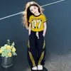 Conjunto de Verão para Meninas 2026 Novo Estilo para Crianças Maiores, Calça Esportiva Solta, Conjunto de Duas Peças com Calça de Perna Larga Curva de Manga Curta Tendência