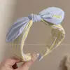 Diadema retorcida fresca y elegante, de lujo ligero para mujer, adecuada para el uso diario en primavera y verano, diadema de ala ancha, dulce accesorio para el cabello estilo coreano
