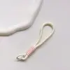 Correa de Muñeca Trenzada Estilo Ins Lanyard Nudado Cuerda Corta de Silicona Colgante Antiperdida para Teléfono Dopamina