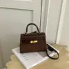 Bolso de mano de nicho de alta gama transfronterizo bolso Kelly para mujer 2026 nuevo bolso de hombro de moda bolso cruzado casual para el día a día para mujer