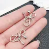 Misturado 15 K branco banho de cor duradoura laço pingente de liga de zinco pulseira Coringa DIY acessórios de joias fabricantes atacado