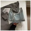 Bolso de mezclilla nuevo para mujer 2026, bolso bandolera de cadena acolchado de moda, bolso de media luna versátil casual de verano con textura