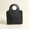 Bolsas redondas de tela no tejida, diseño simple, adecuadas para ropa de mujer, bolsos de mano, empaque de prendas de vestir, bolsas de compras y ropa para niños; disponible en stock