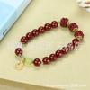 Pulsera de cinabrio rojo al por mayor con alto contenido de arena de oro púrpura de 8 m de cuentas redondas con colgante pulsera de la paz golondrina bestia valiente viva