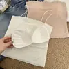 Camisola sin costuras de seda helada de longitud media sin tirantes para mujer con almohadillas en el busto, espalda hermosa, bordes ondulados y diseño anti-exposición