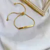 Pulsera de joyería de moda dorada ins para combinar con todo, pulsera de acero de titanio simple de lujo ligero, trébol de cuatro hojas para mujer, transfronteriza
