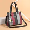 Bolso de mujer nuevo 2024 bolso de hombro de moda bolso cruzado bolso de lona bolso de mano de color contrastante bolso tote simple combinable
