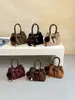 Nuevo bolso Boston retro de gamuza 2026, bolso de hombro mini para mujer, bolso cruzado, diseño único, bolso tipo cubo de mano