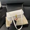 Design Moderno e Único 2025 Outono Nova Moda Retrô Cor Sólida Elegante Simples Versátil Bolsa de Ombro de Mão
