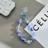Corrente de Celular Feita à Mão com Contas Estilo Blind Box Tema Dopamina com Três Cordões e Pingente de Boneca Pintado à Mão