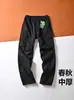 Calça de trabalho estilo americano para homens, comércio exterior transfronteiriço da Amazon, calça casual de corte solto para primavera e outono com múltiplos bolsos, calça comprida casual masculina