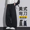 Calças casuais masculinas de perna curva, nova coleção outono/inverno 2026, feitas de tecido Lyocell, estilo americano moderno, versáteis, com caimento solto e design fluido