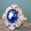 Anillo abierto de alta gama con zafiro azul real y diamantes de imitación, ideal para mujeres.