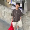 Tienda de Algodón Ropa de Verano para Niños Camiseta Versátil de Manga Corta para Niños 2026 Nuevo Estilo Coreano Resistente de Moda Lavada Moda Infantil