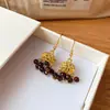 Pendientes de borla con carcasa de madera marrón transfronterizos europeos y americanos, pendientes de estilo vintage Maillard, pendientes de mujer de lujo ligero de alta gama