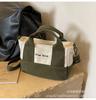 Bolsa de Lona Color Blocking Casual Coreana para Mulheres 2026 Nova Moda Bolsa de Mão Pequena para o Dia a Dia Leve Popular Bolsa Transversal