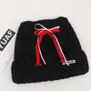 Gorro de punto de mezcla de lana de alta calidad con un lazo y orejas de gato, diseñado para mujeres, perfecto para otoño e invierno, proporcionando calidez y protección para los oídos, y haciendo que el rostro parezca más pequeño