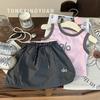 Tong xingyuan versión coreana de ropa para niños nuevo verano niñas combinación de colores letra camiseta de manga corta falda pantalones para niños traje de dos piezas moda
