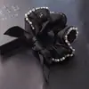 Acessórios de cabelo novos para primavera e verão atacado anel de cabelo com laço de organza corda de cabelo simples para mulheres elástico capa de couro