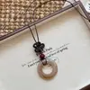 ¡Galería de Arte! Collar con Colgante Irregular Marrón Retro Cadena Larga para Suéter Femenino Accesorios de Alta Gama