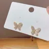 Brincos Exquisitos Mini Coração Borboleta de Prata Esterlina S925 para Mulheres Popular Estilo Fada Simples Versátil Atacado
