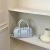Bolsa de bolos para mujer, nuevo estilo coreano de moda primavera 2026, bolso de mano de alta gama versátil para el hombro y cruzado para el trabajo