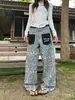 Jeans DSS de estilo retro americano con bolsillos de parche de estampado de leopardo para hombre y mujer, pantalones casuales holgados de pierna ancha curva estilo callejero