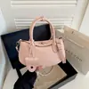 Bolsa de Mão de Moda de Luxo Bolsa Bolinho Feminina 2026 Nova Pequena de Nicho Manual para o Dia a Dia Estilosa de Ombro Único Transversal Pequena