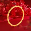 O bracelete feminino estilo Zhou Jia Shengshi Huacai Heart, com trama de losangos dourados, banhado a ouro 24k, para atacado