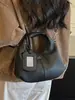 Yaozi 2026 otoño temprano nueva moda versátil casual simple bolso de hombro con textura retro, adecuado para ir al trabajo, se puede llevar en la mano o cruzar.