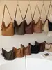 Nuevo bolso cubo versátil transfronterizo para mujer, bolso de hombro y bandolera de gamuza moderno y de alta gama, bolso cesta de moda para el día a día