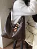 Bolso de Lona Retro de Gran Capacidad para Salir y Viajar 2026 Nuevo Elegante Casual Color Sólido Debajo del Brazo Diseño de Moda Bolso de Hombro