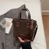 Bolso cubeta personalizado casual de nicho, bolso de moda retro de nuevo estilo, nuevo bolso de hombro y bandolera para mujer 2026