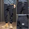 Pantalones casuales para hombre otoño e invierno Nuevos costuras engrosadas holgados combinan con todo modernos juveniles tobillo atado Overoles para hombre