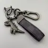 Chaveiro de Dinossauro Fofo Desenho Animado Pingente de Metal Estilo Casal para Carro Masculino Chaveiro de Corda de Couro de Alta Qualidade para Pendurar na Cintura