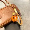 Miu wind alkali water bread llavero hebilla bagel cuerda tejida de chocolate moda colgante para mochila escolar regalo de graduación