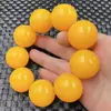 Pulsera de cera de abeja amarilla de aceite de pollo al por mayor pulsera de cera artificial pulsera de 30 mm pulsera amarillo dorado pulsera grande