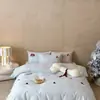 Novo Conjunto de Quatro Peças de Roupa de Cama de Algodão de Fibra Longa 100S Estampado de Desenho Animado para Primavera e Verão, Incluindo Lençóis, Capa de Colcha, Roupa de Cama e Toalha Bordada Infantil