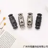 Hebilla elástica de metal de doble cabeza cilíndrica con dos agujeros para cordón, hebilla de resorte T5008