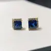 Una generación de pendientes de plata 925 incrustados con diamantes azules cuadrados de Princesa pendientes de oro medio anillo diamante roto incrustación de cuatro garras