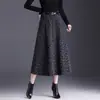 Saia de Lã Estampada Linha A Feminina 2026 Outono Inverno Nova Cintura Alta Moda Barra Larga Emagrecedora Casual Midi