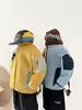 Valle del Viento 2026 Invierno Nueva Chaqueta Estilo Coreano Personalizada para Niños con Bloques de Color Cuello Alto con Forro Polar, Elegante Chaqueta para Niños