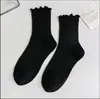 Calcetines JK con volantes para mujer de media caña primavera, otoño y verano tres colores calcetines de algodón color liso encaje japonés calcetines de felpa venta al por mayor de fábrica